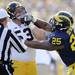Michigan linebacker Kenny Demens and Iowa center James Ferentz tussle after the play back during the first quarter at Michigan Stadium. Melanie Maxwell I AnnArbor.com